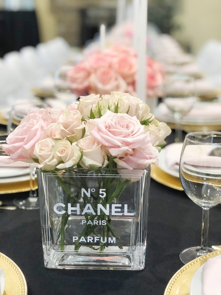 chanel no. 5 centerpiece, chanel party centerpieces, coco chanel perfume bottle flowers, chanel party ideas, chanel party decor